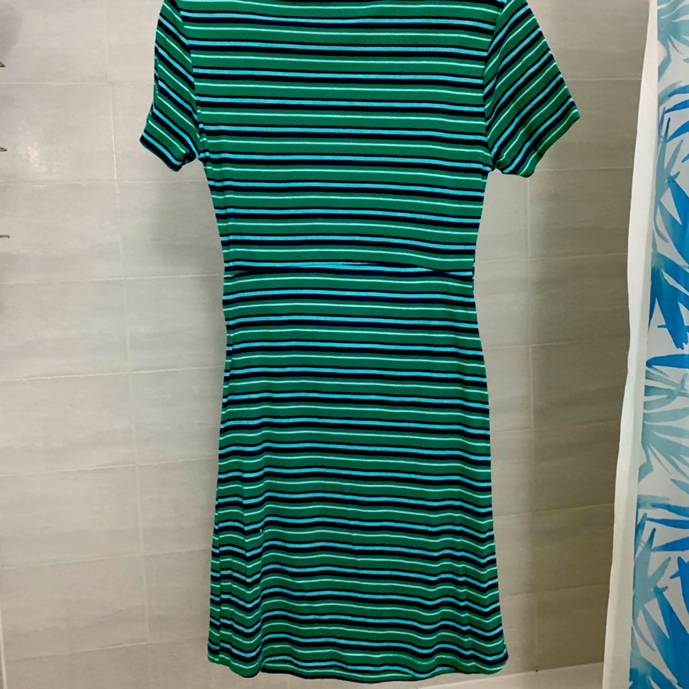 Turquoise T-shirt dress.With slit in the middle.